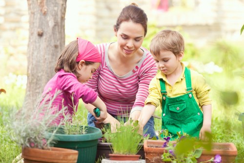 Gardening crew assessing a semi-detached backyard for cubic-yard estimate
